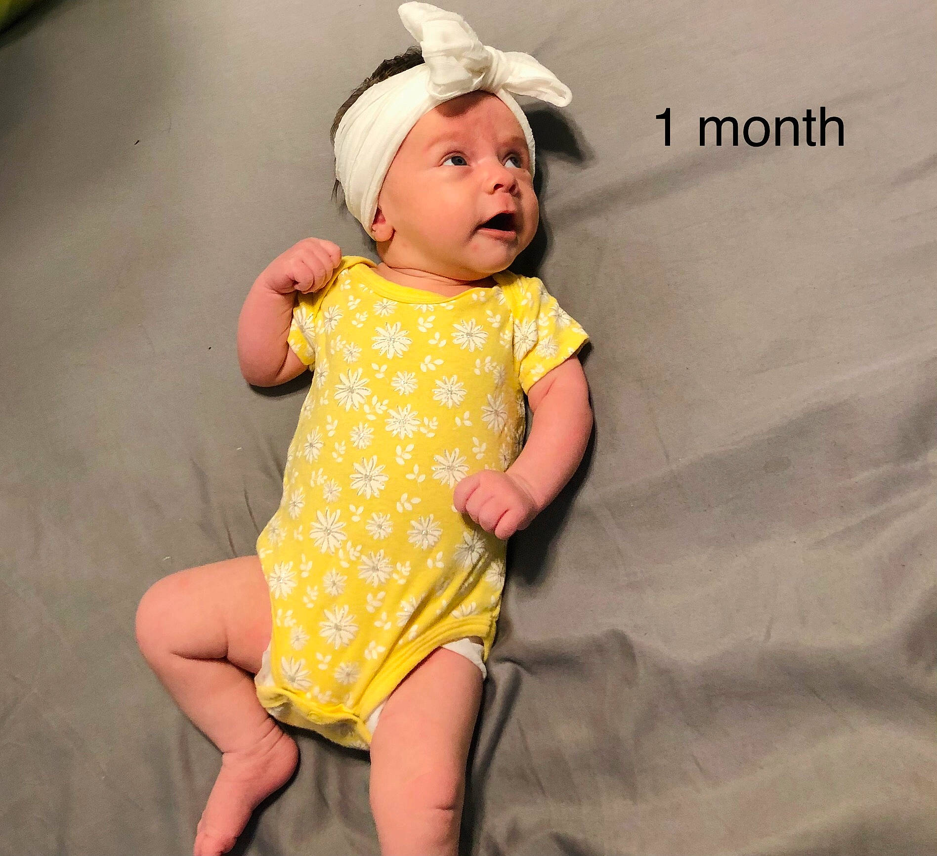 Brylee is registered to the contest to win money with this photo: baby, baby_toddler_clothing, cheek, child, collar, dress, face, finger, fun, happy, headgear, headwear, human_leg, one_piece_garment, pattern, person, pink, sleeve, smile, thigh