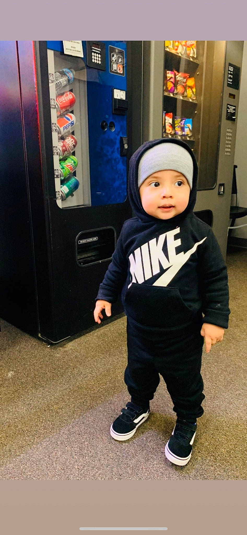 Lionel is registered to the contest to win money with this photo: baby, beanie, cap, child, cool, costume, games, headgear, headwear, outerwear, person, shoe, sleeve, sportswear, standing, t_shirt, toddler