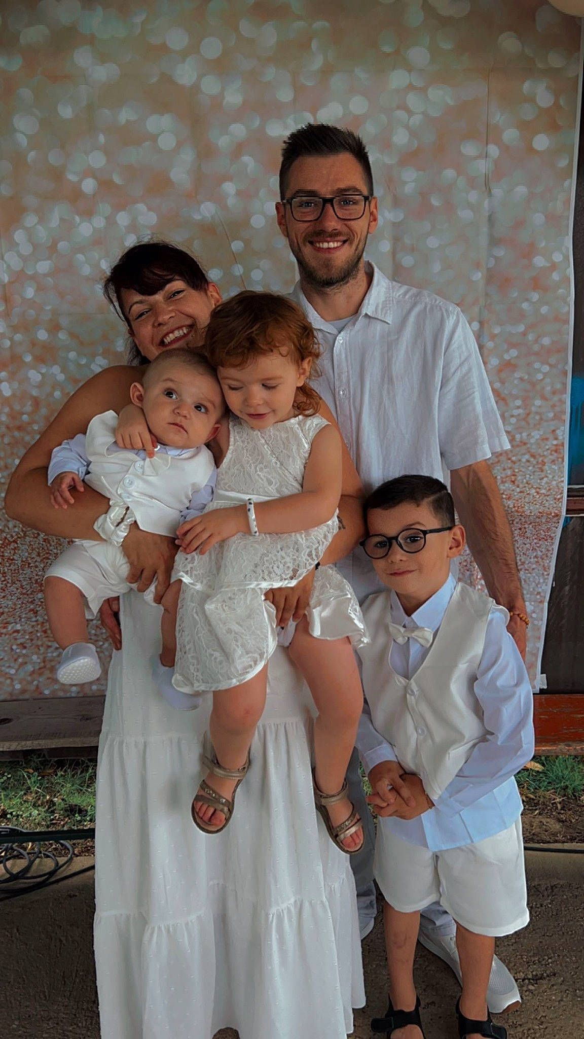 Sélyano participe au concours pour gagner de l'argent avec cette photo : baby, bridal_accessory, bridal_clothing, bridal_party_dress, event, face, flash_photography, formal_wear, fun, gesture, gown, happy, interaction, joy, person, photograph, shoulder, skin, smile, toddler