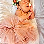 newborn, baby, sleeping, tutu, pink, headband, flowers, floral, blanket, soft, star_pattern, infant, cute, peaceful, skin, foot, hand, resting, portrait, indoors