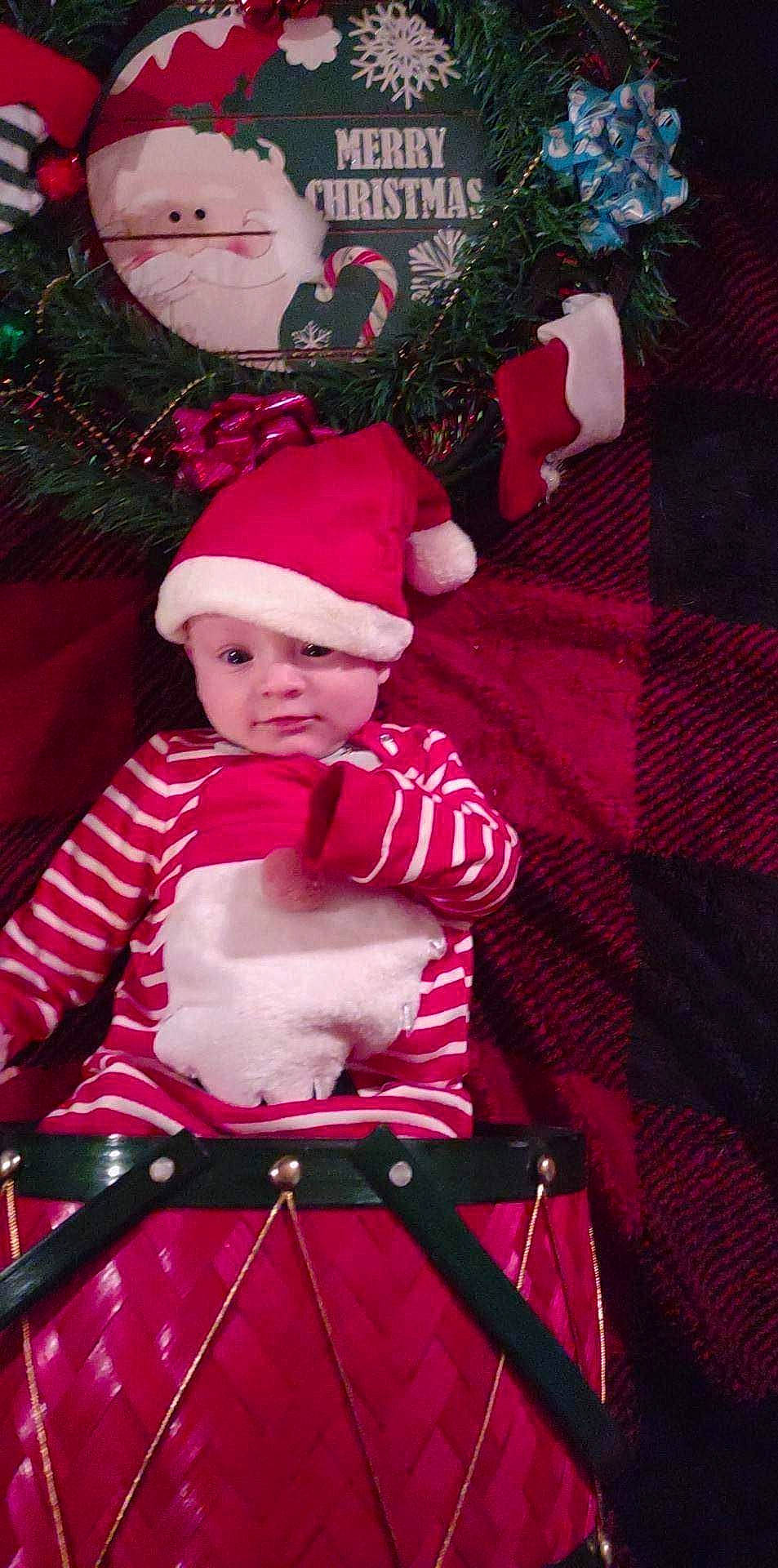 Azrael joined the competition — help win amazing prizes! baby, baby_toddler_clothing, cap, child, christmas, costume_hat, event, fictional_character, fun, happy, headwear, holiday, magenta, person, pink, plant, purple, red, santa_claus, toddler