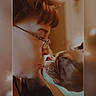 Leo Aloysius Ketter joined the competition — help win amazing prizes! person, dog, glasses, face, closeup, nose, intimate, warm_lighting, vintage_filter, indoor, affection, bond, pet, animal, human, side_profile, glasses_frame, expression, love, interaction
