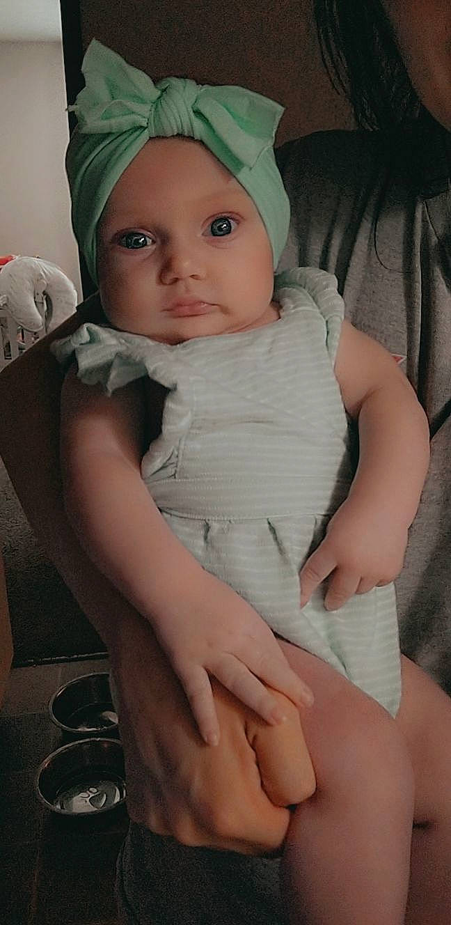 Stella joined the competition — help win amazing prizes! baby, baby_toddler_clothing, cap, cheek, chin, comfort, eye, eyelash, face, finger, hand, headgear, headwear, iris, lip, mouth, neck, organ, person, pink