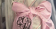 Emma joined the competition — help win amazing prizes! newborn, baby, sleeping, swaddled, hospital_bassinet, blanket, bow, pink, striped, infant, face, peaceful, hospital, crib, person, cute, resting, soft, decorations, monogram