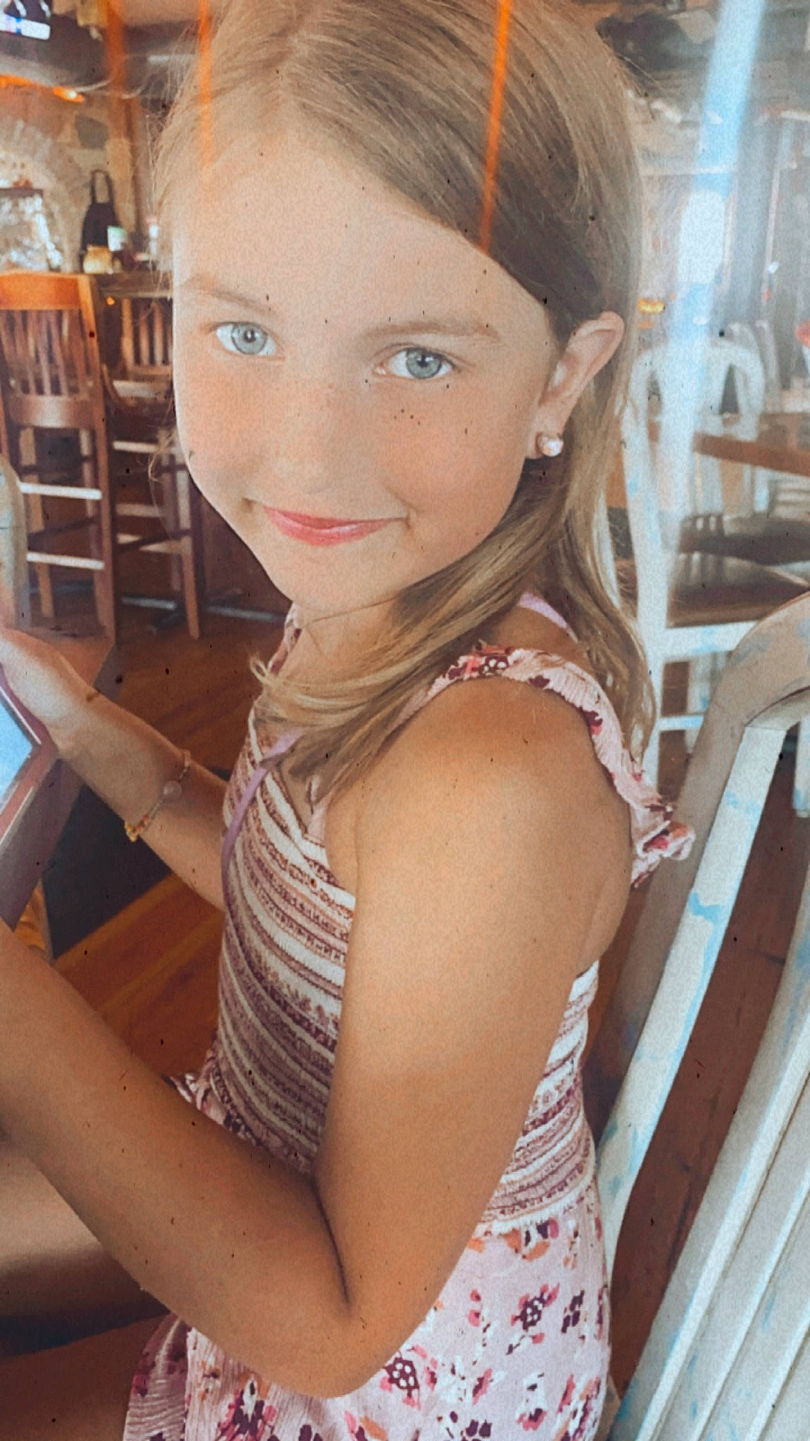 Rylee is registered to the contest to win money with this photo: bangs, black_hair, chair, cheek, chin, eyebrow, eyelash, forehead, fun, hair, hairstyle, happy, human_body, iris, joy, lip, neck, organ, person, shoulder