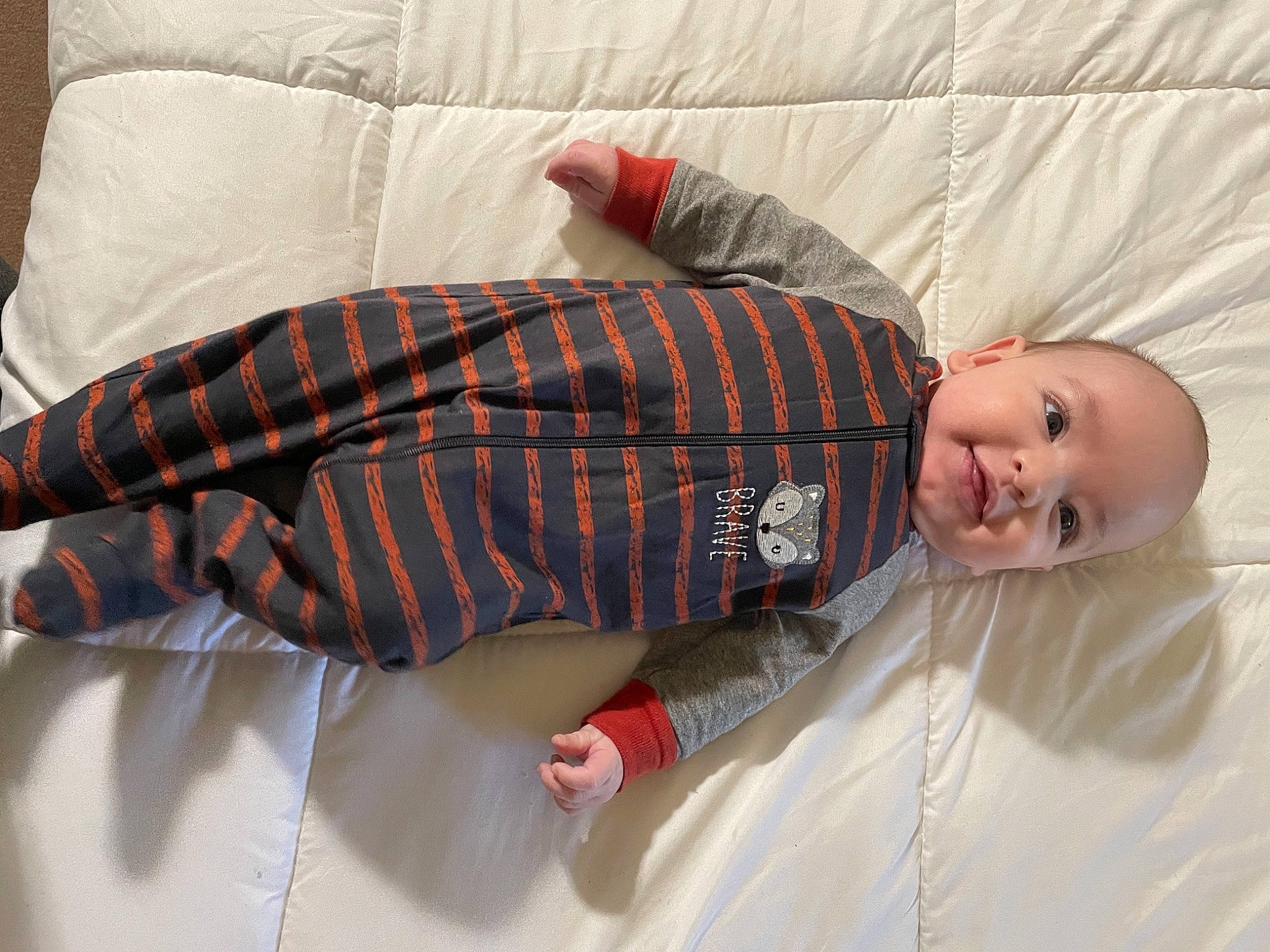 Landon joined the competition — help win amazing prizes! baby, baby_sleeping, baby_toddler_clothing, bedding, bedtime, carmine, child, comfort, couch, flooring, linens, orange, pattern, person, plaid, product, room, skin, sleeve, tartan