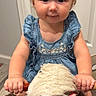 toddler, child, plush_toy, rocking_horse, blue_dress, headband, indoor, flooring, wooden_floor, cute, smiling, baby, toy, person, young_child, portrait, holding, playtime, happy, decor