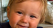 Charleigh is registered to the contest to win money with this photo: toddler, child, smile, bow, headband, face, baby, portrait, indoor, birthday, banner, home, cozy, couch, blanket, clothing, cute, happy, person, young