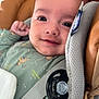 baby, infant, car_seat, smiling, face, clothing, pacifier, safety_belt, child, cute, closeup, person, seatbelt, happy, indoors, young, head, baby_clothes, baby_girl, baby_boy