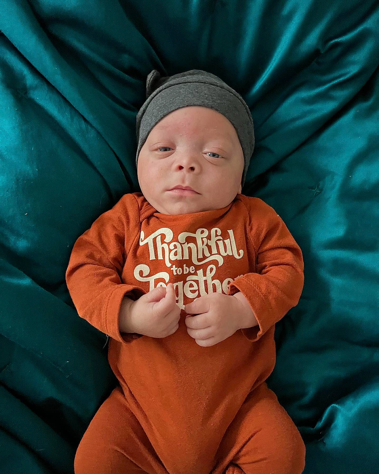 Cairo joined the competition — help win amazing prizes! baby, baby_sleeping, baby_toddler_clothing, cap, chin, comfort, eye, gesture, happy, hat, headwear, human_body, knit_cap, linens, mouth, orange, peach, person, sleeve, t_shirt
