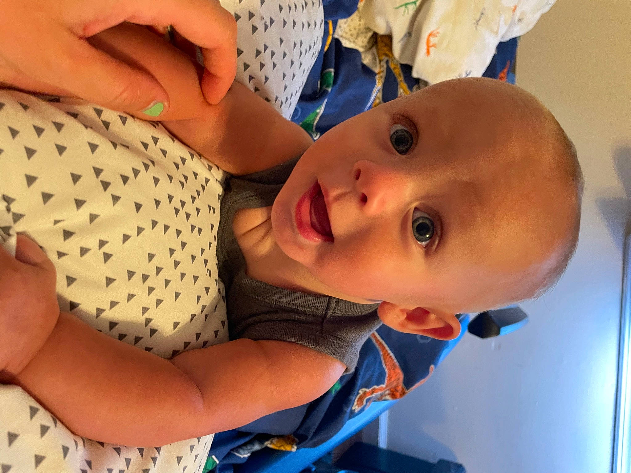 Cayden is registered to the contest to win money with this photo: arm, baby, baby_products, baby_toddler_clothing, cheek, chest, child, elbow, finger, fun, gesture, hand, happy, human_body, nose, pattern, person, skin, smile, surprise