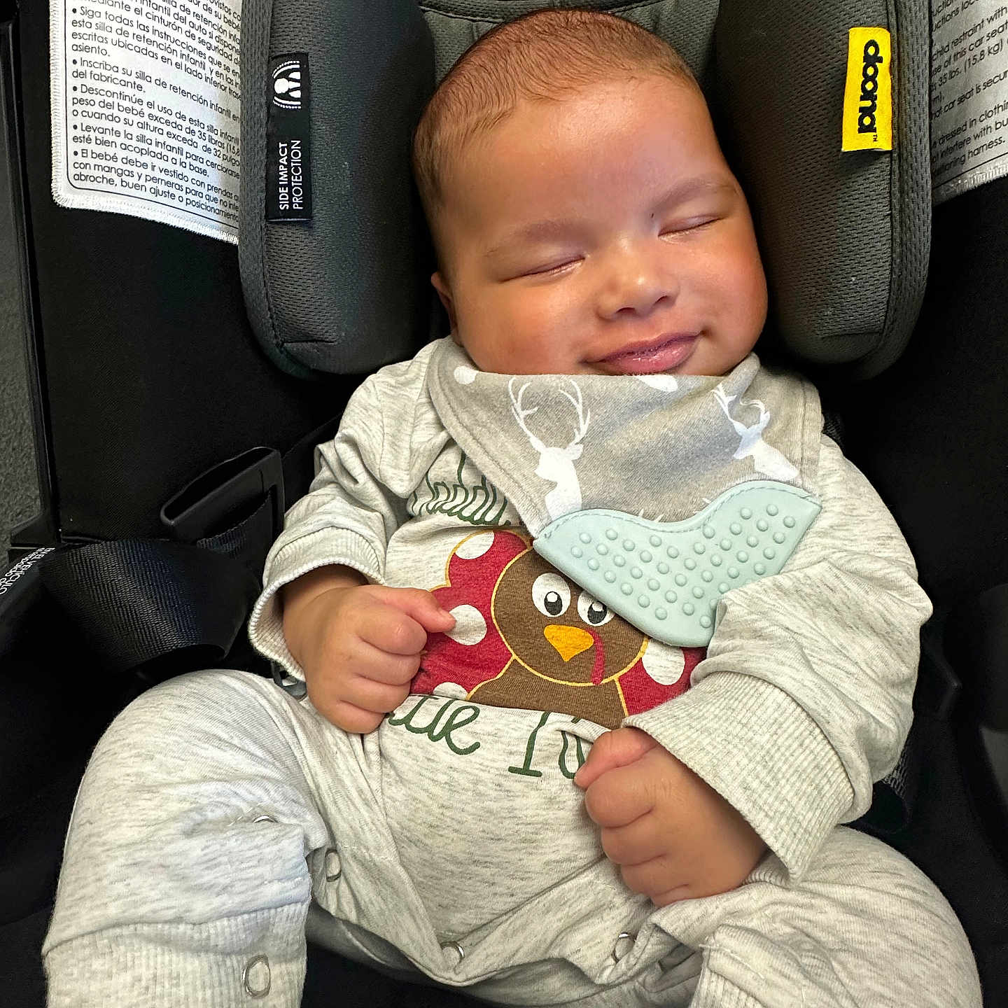 Kashton joined the competition — help win amazing prizes! baby, car, clothing, coat, cushion, face, happy, head, homedecor, jacket, newborn, pants, person, photography, portrait, sitting, sleeping, t_shirt, transportation, vehicle