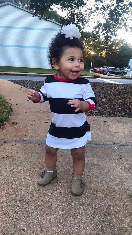 Jayda joined the competition — help win amazing prizes! asphalt, black_hair, child, eye, face, fun, grass, happy, human_leg, leisure, pattern, person, plant, recreation, sandal, sleeve, smile, street_fashion, toddler, tourism