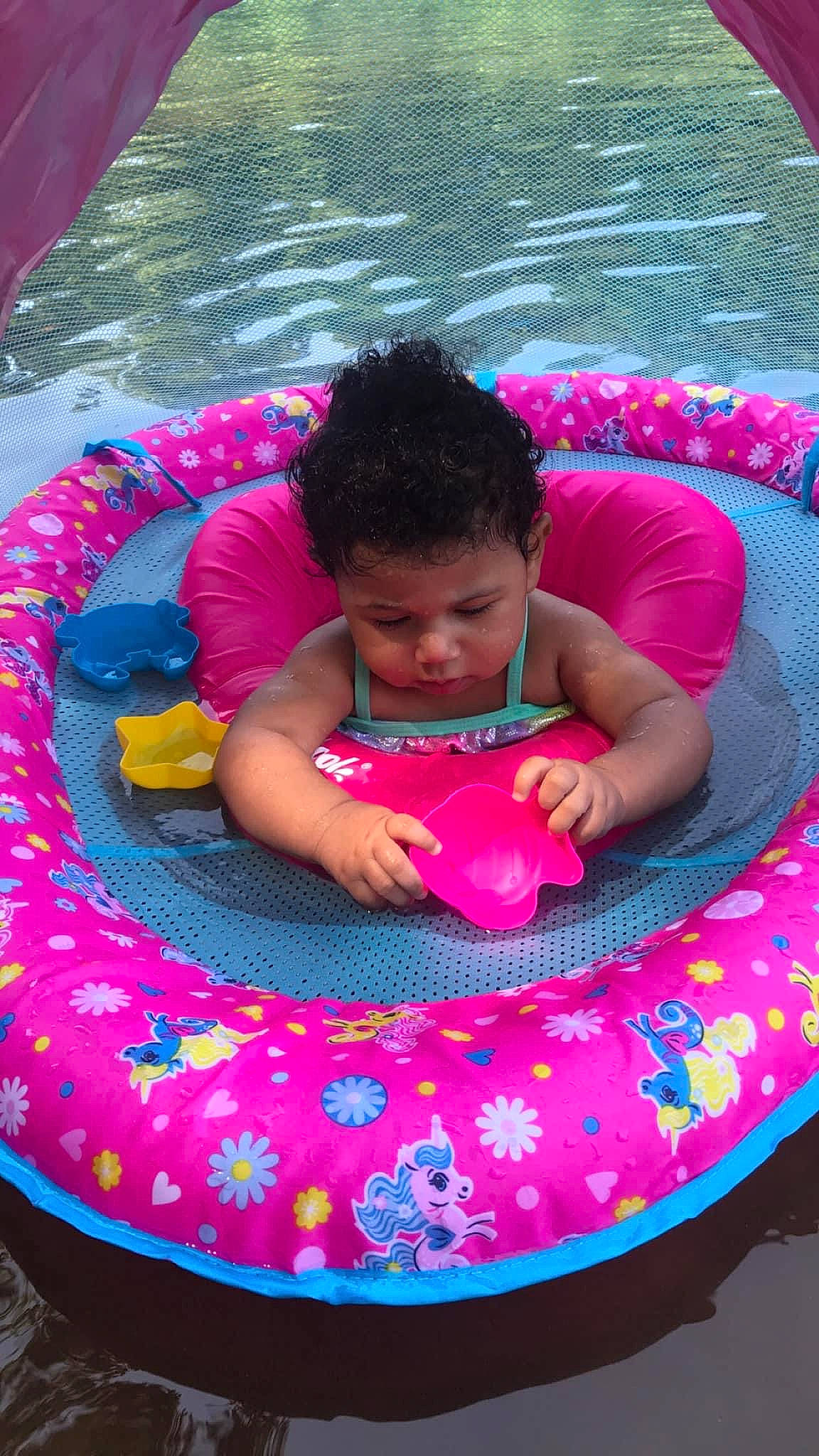 Jayda is registered to the contest to win money with this photo: baby, baby_float, baby_products, baby_toddler_clothing, child, comfort, fun, grass, green, happy, lap, leisure, magenta, outdoor_recreation, person, pink, product, purple, recreation, toddler
