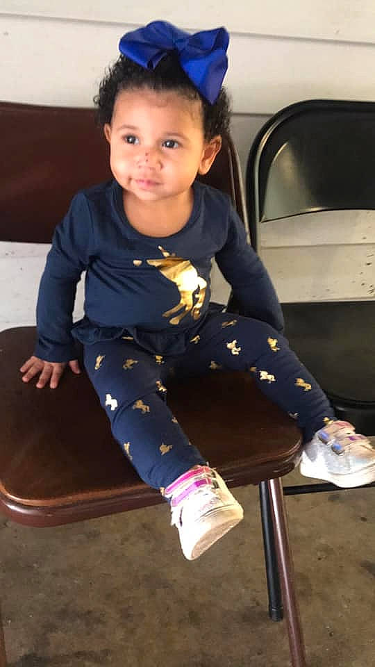 Jayda is registered to the contest to win money with this photo: baby_toddler_clothing, blue, chair, child, clothing, electric_blue, fun, hairstyle, human_leg, knee, leg, leisure, person, product, sitting, sleeve, smile, snapshot, thigh, toddler