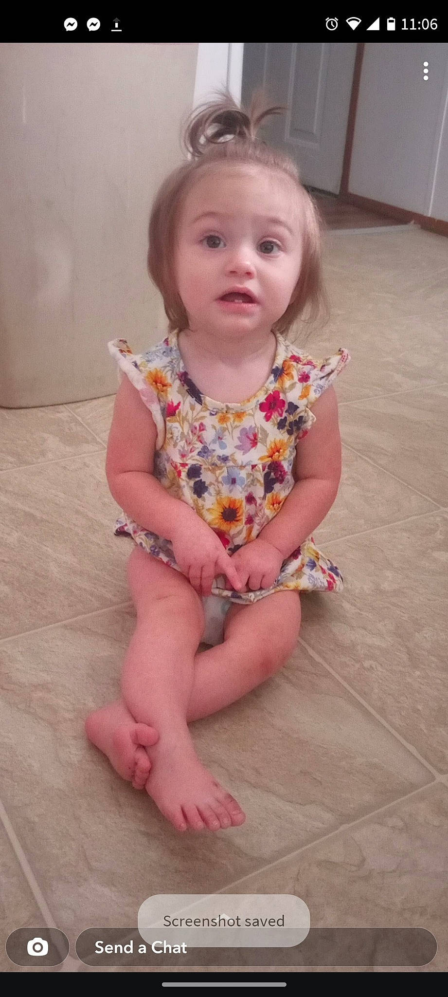 Valerie is registered to the contest to win money with this photo: baby_toddler_clothing, cheek, dress, eye, face, finger, floor, flooring, hair, head, human_body, human_leg, iris, lip, neck, person, pink, skin, sleeve, surprise