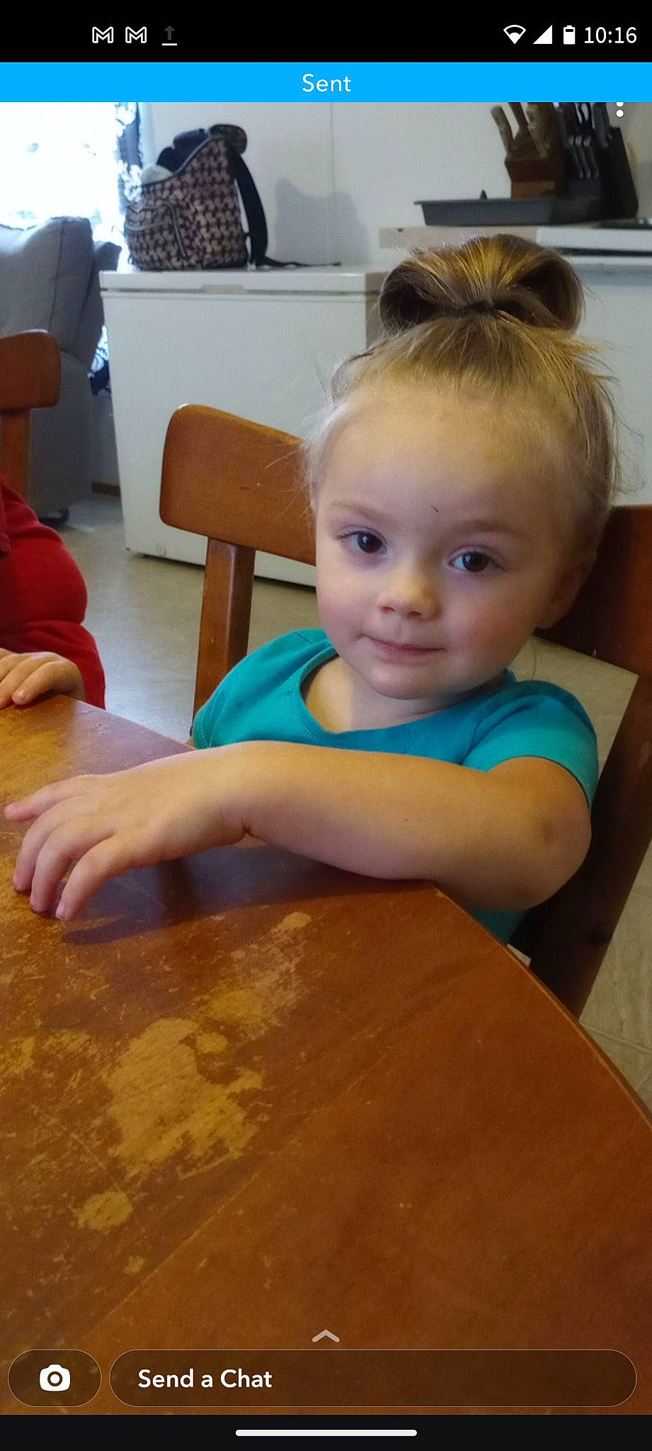 Jazmine is registered to the contest to win money with this photo: chair, cheek, child, eyelash, floor, flooring, fun, hairstyle, happy, hardwood, iris, person, room, sitting, skin, smile, table, toddler, varnish, wood