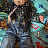 baby, child, infant, pacifier, portrait, sitting, blanket, denim, overalls, shirt, patterned_clothing, blue, indoors, cozy, wide_eyed, fist, fabric, textile, close_up, playful