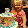 Grace is registered to the contest to win money with this photo: child, birthday, cake, candle, pink_shirt, birthday_ribbon, spongebob, sprinkles, smile, party, celebration, kitchen, granite_countertop, long_hair, happy, food, dessert, icing, table, sitting