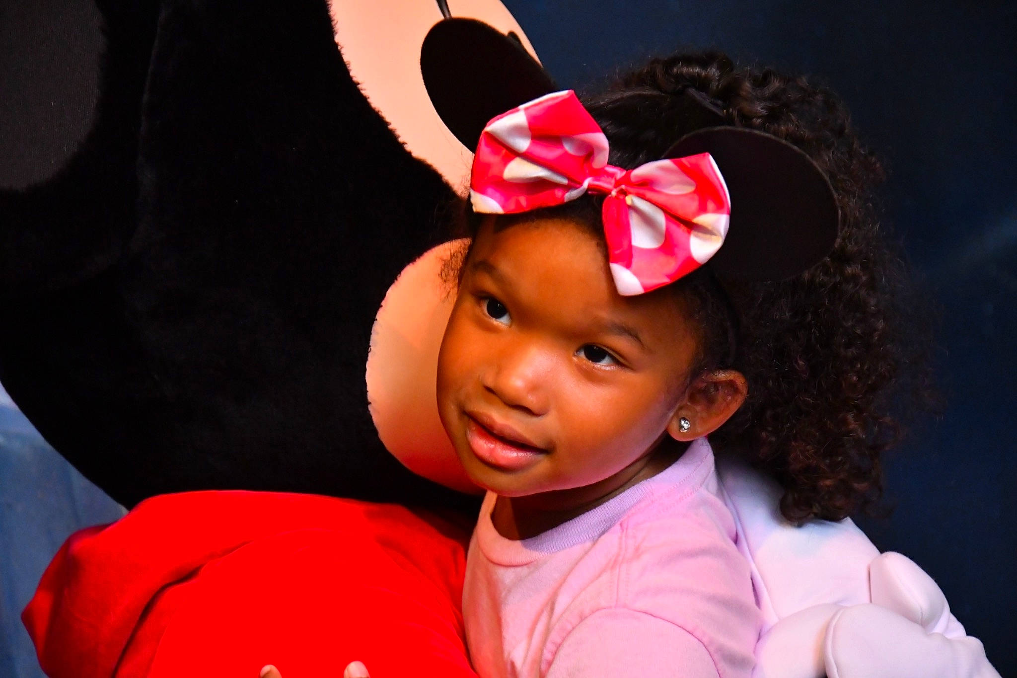 Celine is registered to the contest to win money with this photo: baby, black_hair, child, ear, fashion_accessory, hair_accessory, headband, headgear, headwear, person, pink, red, smile, toddler