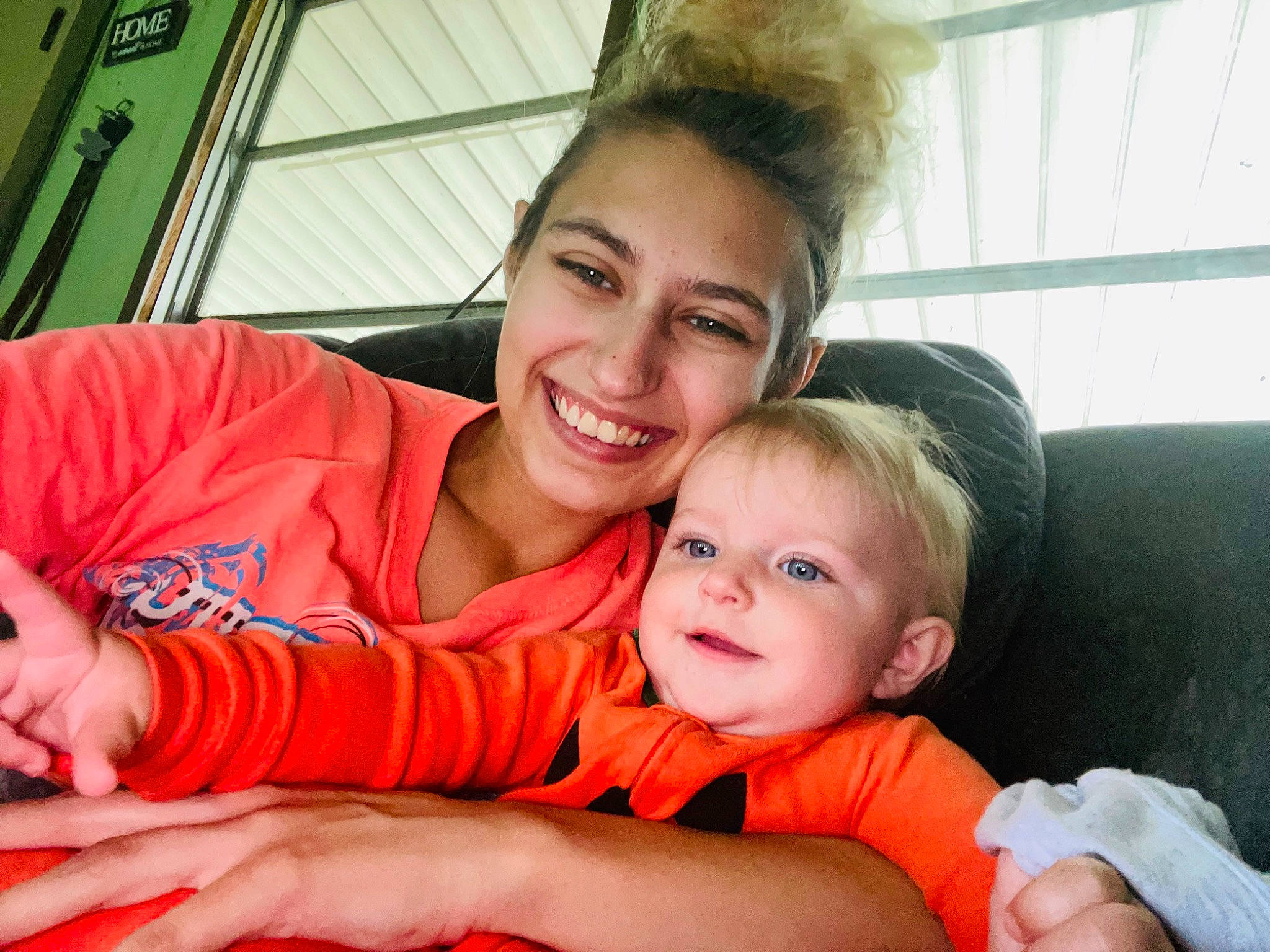 Everlynn joined the competition — help win amazing prizes! child, comfort, event, facial_expression, fun, gesture, grass, happy, interaction, joy, lap, leisure, person, room, sitting, skin, smile, t_shirt, thumb, toddler