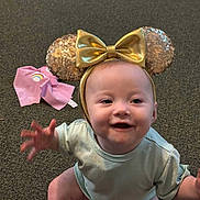 Kodi joined the competition — help win amazing prizes! baby, bow, carpet, child, clothing, cute, face, fashion, gold, happy, headband, indoor, infant, pink, portrait, rainbow, reaching, sequins, sitting, smiling