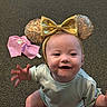 baby, bow, carpet, child, clothing, cute, face, fashion, gold, happy, headband, indoor, infant, pink, portrait, rainbow, reaching, sequins, sitting, smiling