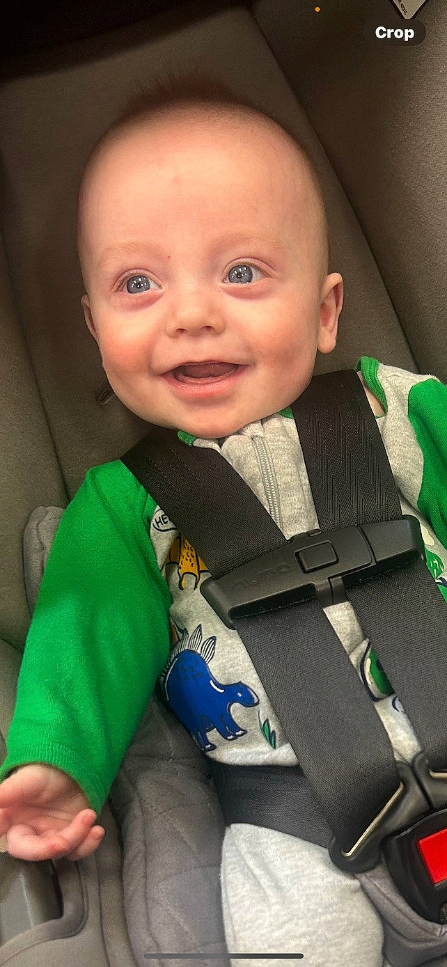 accessories, baby, belt, clothing, coat, cushion, face, gun, happy, head, homedecor, jacket, pants, person, photography, portrait, seatbelt, smile, strap, weapon