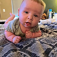 Hayden joined the competition — help win amazing prizes! baby, infant, child, blanket, bed, tummy_time, curious, indoors, person, face, skin, clothing, short_hair, cute, young, plush, furniture, head, expression, comfortable