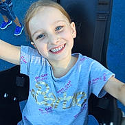 Kyeisha is registered to the contest to win money with this photo: child, smiling, face, blue_eyes, tshirt, barbie, swing, playground, outdoor, joyful, happy, person, short_sleeves, casual_clothing, seat, fun, young, childhood, summer, park