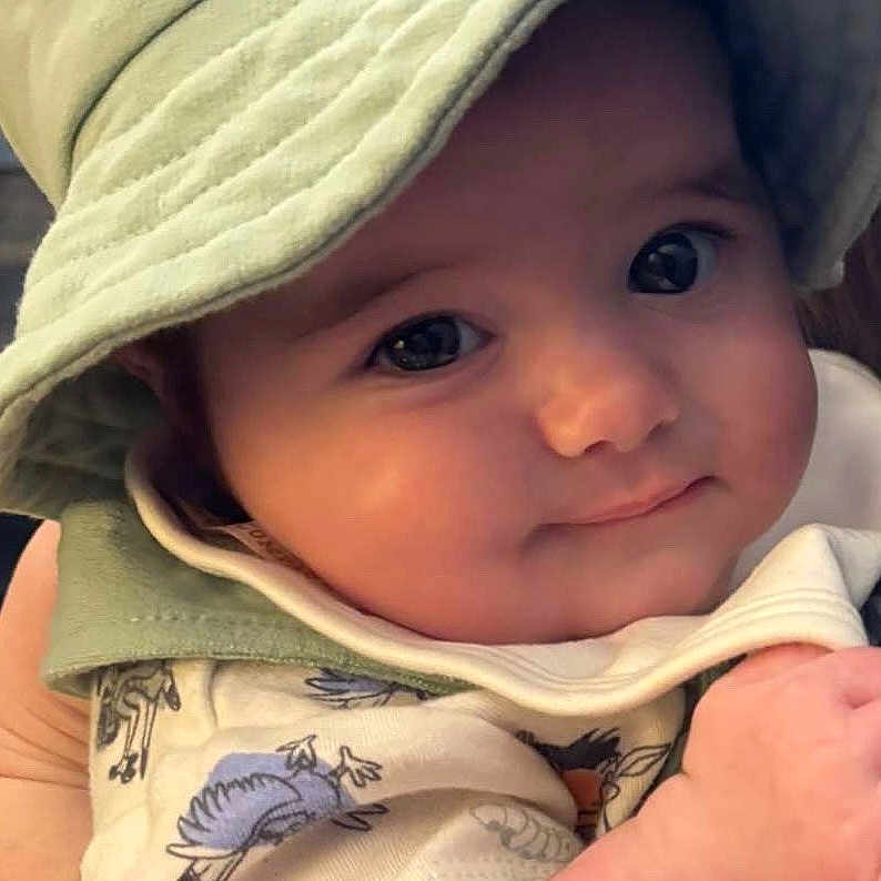 Penelope is registered to the contest to win money with this photo: baby, baseballcap, bonnet, cap, clothing, coat, costume, face, happy, hat, head, hood, jacket, newborn, pants, person, photography, portrait, smile, sunhat