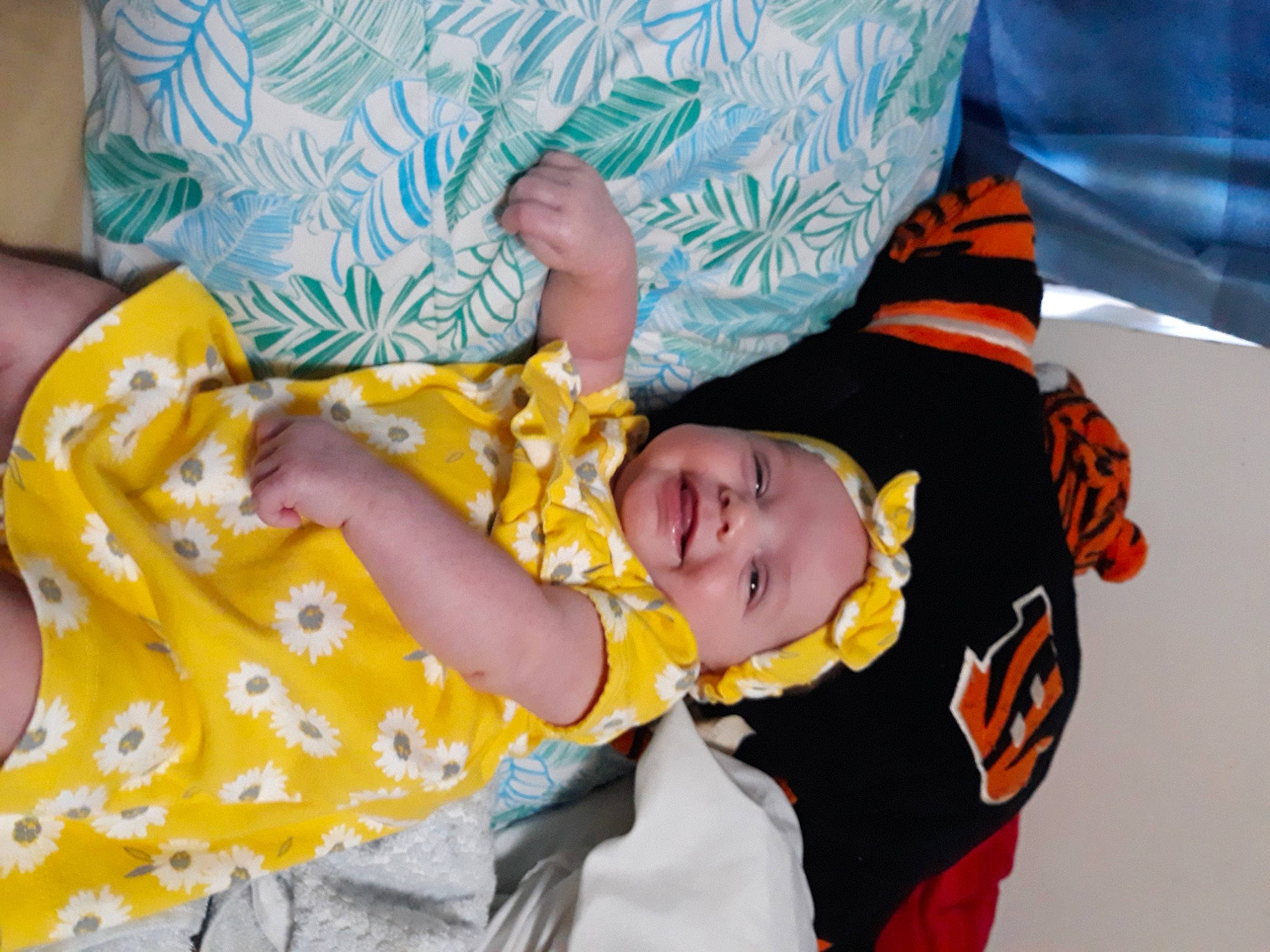 Jazmin is registered to the contest to win money with this photo: baby_toddler_clothing, child, comfort, elbow, event, fun, happy, headwear, joy, leisure, linens, pattern, person, room, sitting, sleeve, smile, t_shirt, toddler