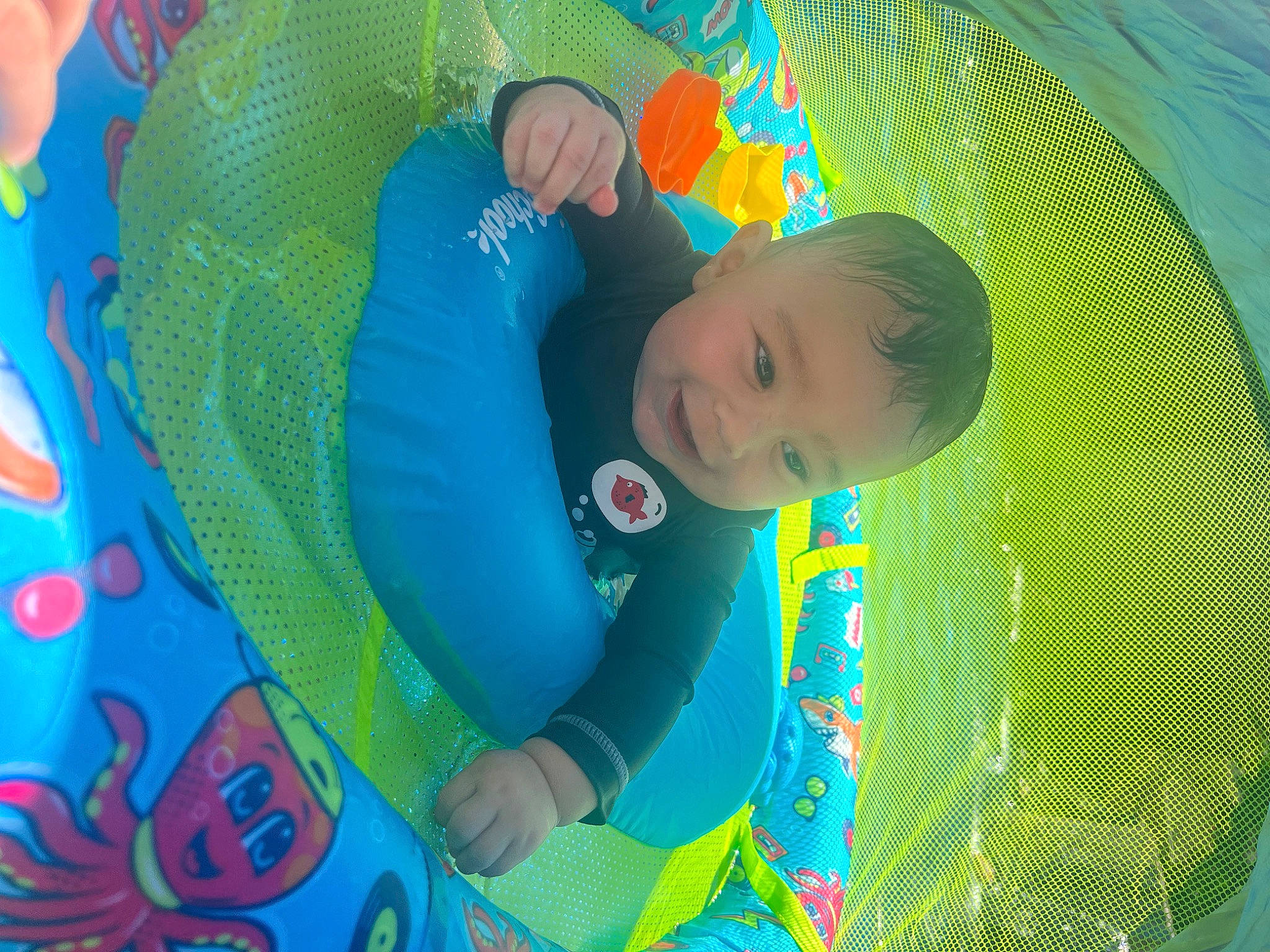 Dreysten is registered to the contest to win money with this photo: aqua, art, baby, baby_products, baby_toddler_clothing, child, circle, comfort, electric_blue, fun, grass, green, happy, leisure, magenta, pattern, person, play, toddler, visual_arts