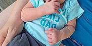 Nash joined the competition — help win amazing prizes! arm, baby, blue_clothing, casual, closeup, cute, foot, gravel, gray_pants, hand, infant, lap, outdoor, peaceful, person, relaxing, skin, sleeping, tattoo, wooden_planks