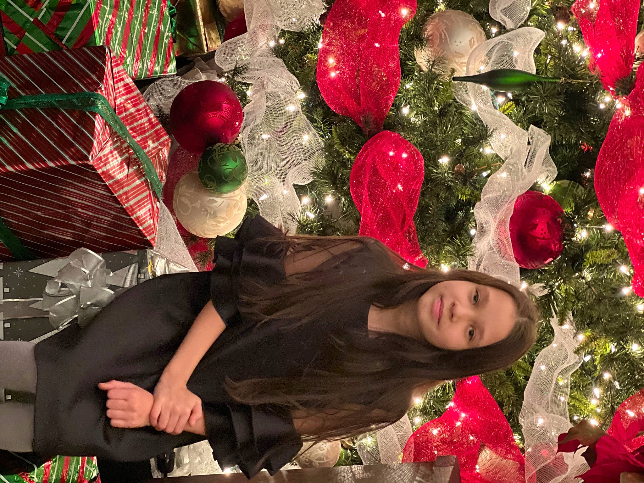 Veronika is registered to the contest to win money with this photo: beauty, christmas_decoration, christmas_ornament, christmas_tree, dress, event, fun, happy, holiday, holiday_ornament, human_body, interaction, joy, ornament, party_supply, people_in_nature, person, pink, plant, red