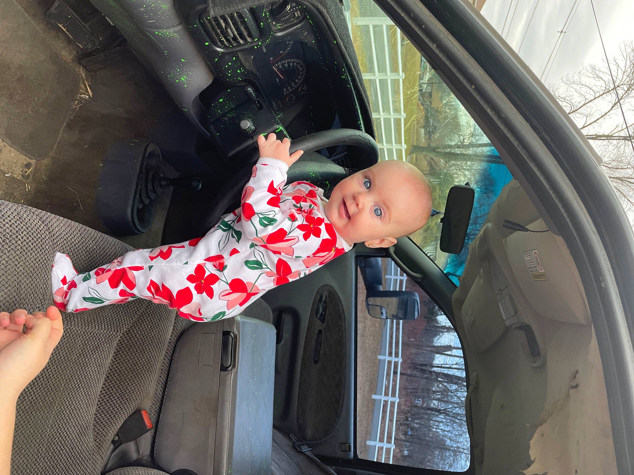 Mercedes is registered to the contest to win money with this photo: auto_part, automotive_design, automotive_exterior, automotive_lighting, automotive_mirror, car, car_seat, glass, hood, mode_of_transport, motor_vehicle, person, personal_luxury_car, plant, tints_and_shades, tree, trunk, vehicle, vehicle_door, window