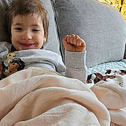 Charlotte joined the competition — help win amazing prizes! baby, bed, blanket, bodypart, couch, cushion, face, finger, furniture, hand, happy, head, homedecor, linen, person, photography, pillow, portrait, quilt, smile