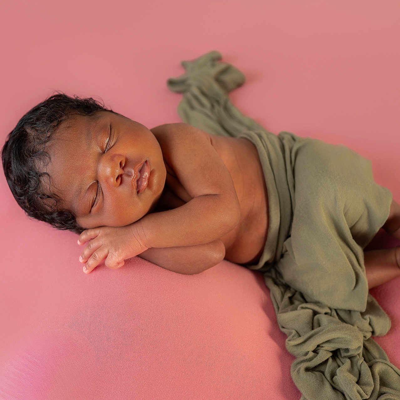 Daziyia is registered to the contest to win money with this photo: newborn, baby, sleeping, infant, wrapped, cloth, pink_background, peaceful, cute, portrait, soft, resting, small_hands, small_feet, studio_photo, closeup, calm, toddler, child, skin