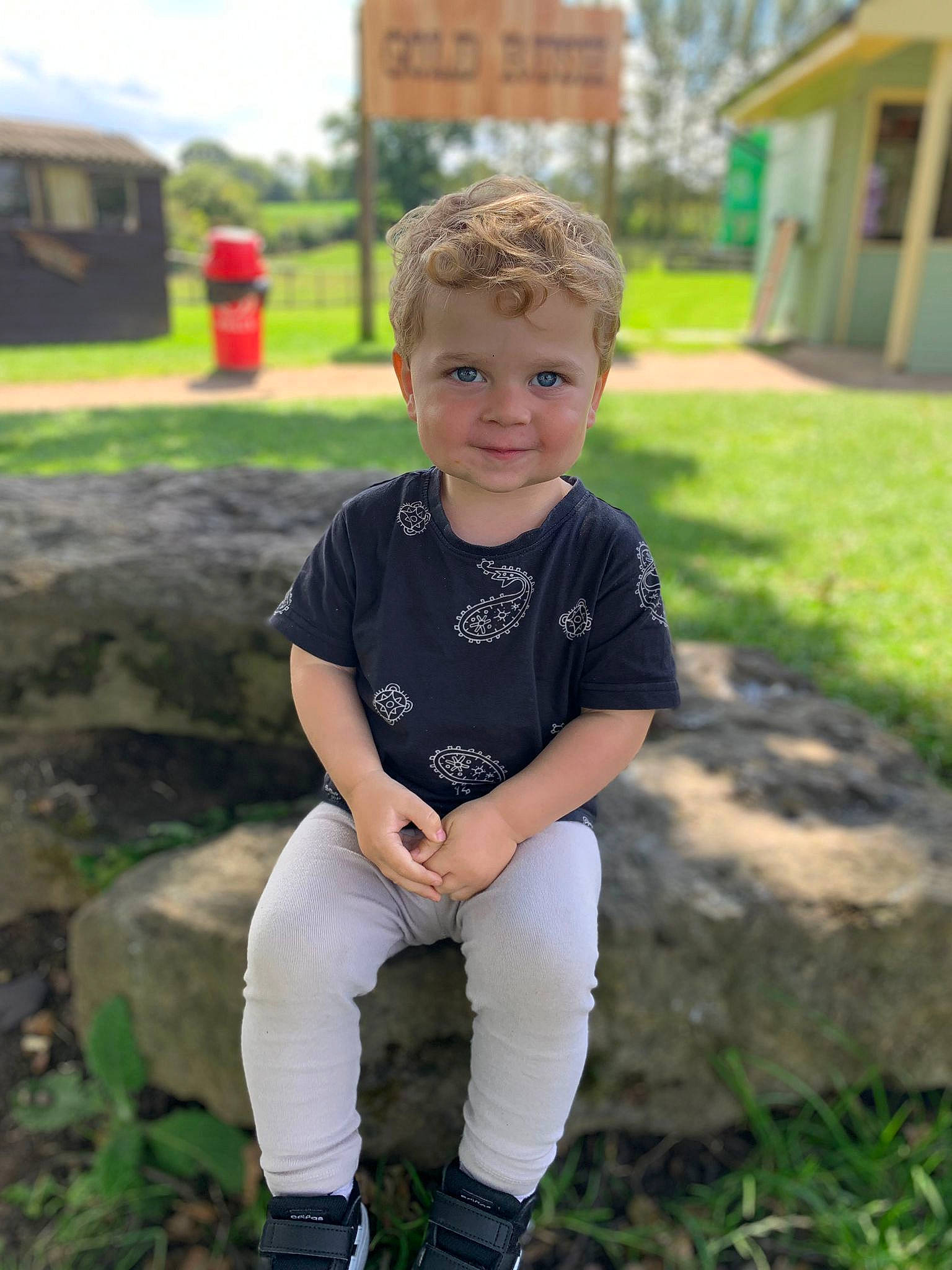 Billy joined the competition — help win amazing prizes! boot, child, eye, face, fun, grass, happy, knee, leisure, people_in_nature, person, plant, recreation, sitting, sleeve, smile, spring, summer, t_shirt, toddler