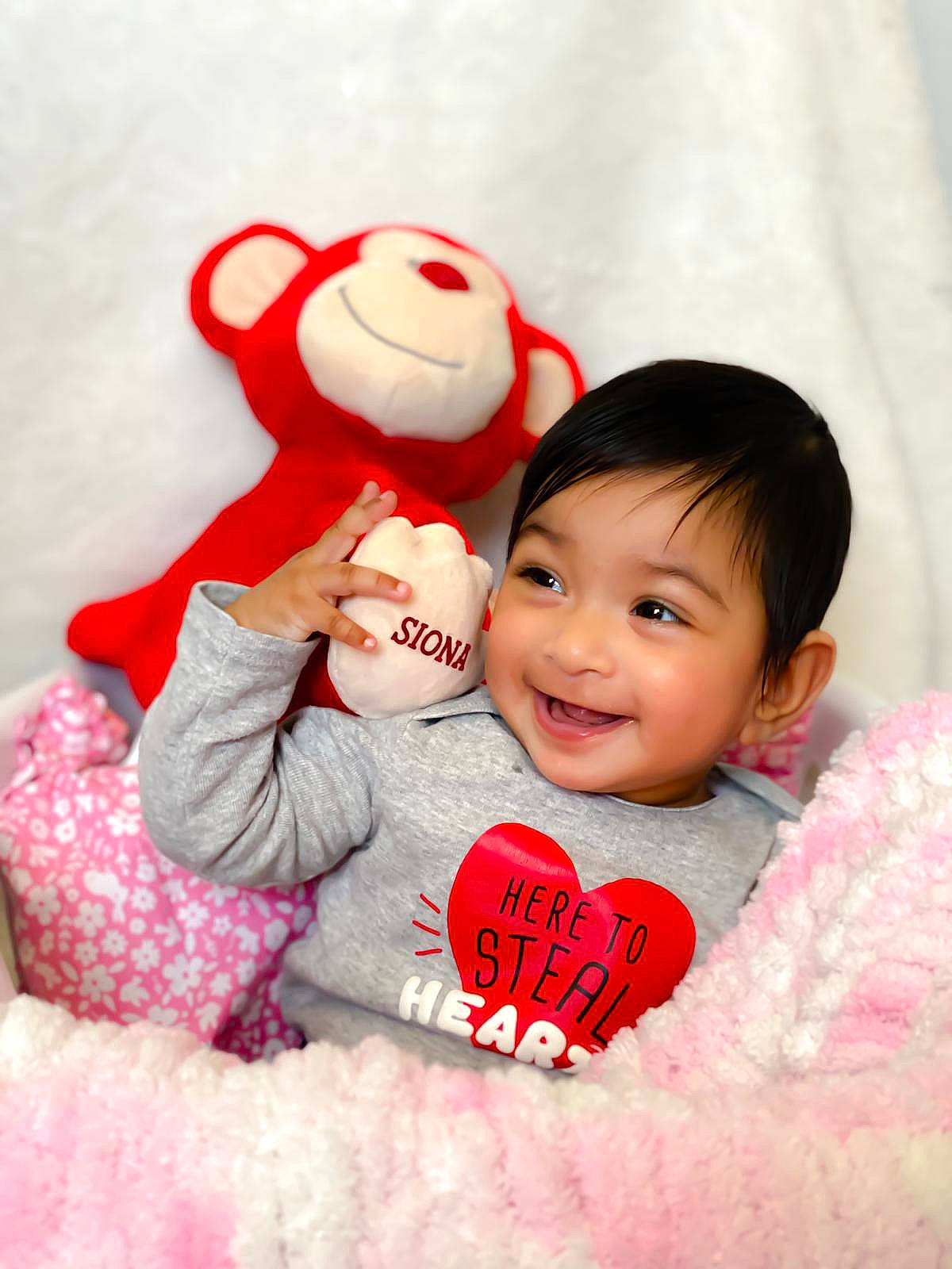 Siona joined the competition — help win amazing prizes! baby, baby_toddler_clothing, child, daughter, happy, joy, love, person, pink, plush, red, skin, smile, stuffed_toy, textile, toddler, valentines_day