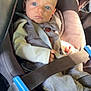 baby, blue_eyes, car_seat, seatbelt, infant, clothing, bow_tie, gray_outfit, child, sitting, sunlight, safety, portrait, young_child, cute, secure, indoors, car_interior, hands, face