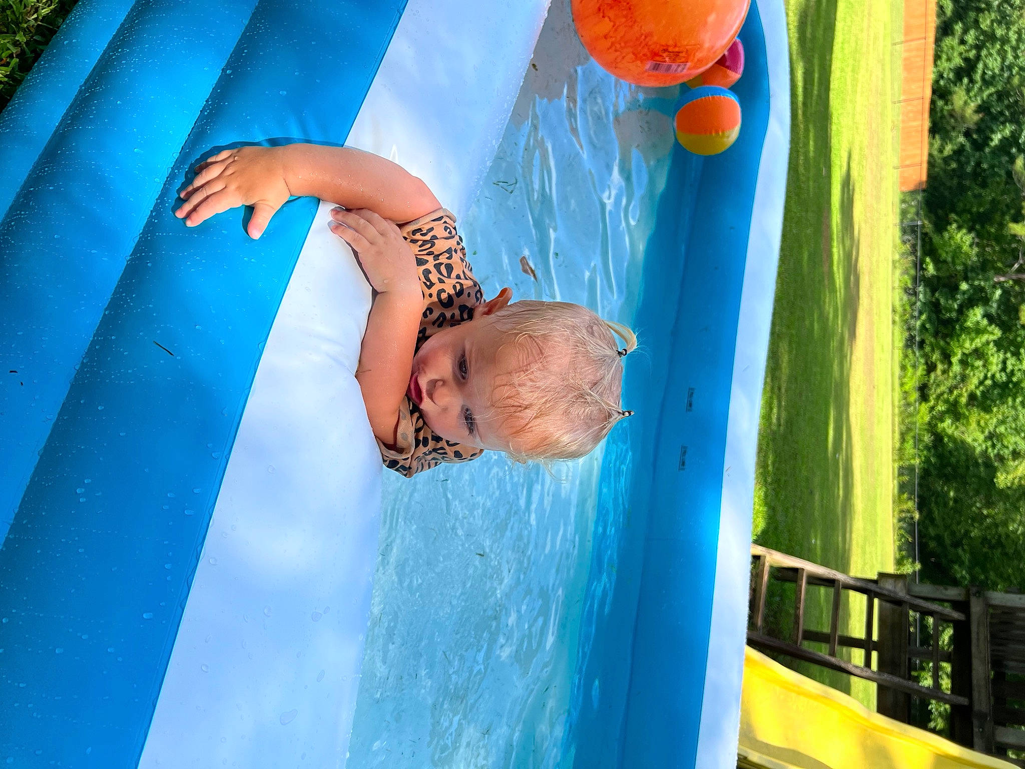 Kimber is registered to the contest to win money with this photo: aqua, azure, beauty, blue, child, elbow, electric_blue, fun, happy, human_leg, leisure, light, person, photograph, plant, recreation, red, summer, swimming_pool, vacation