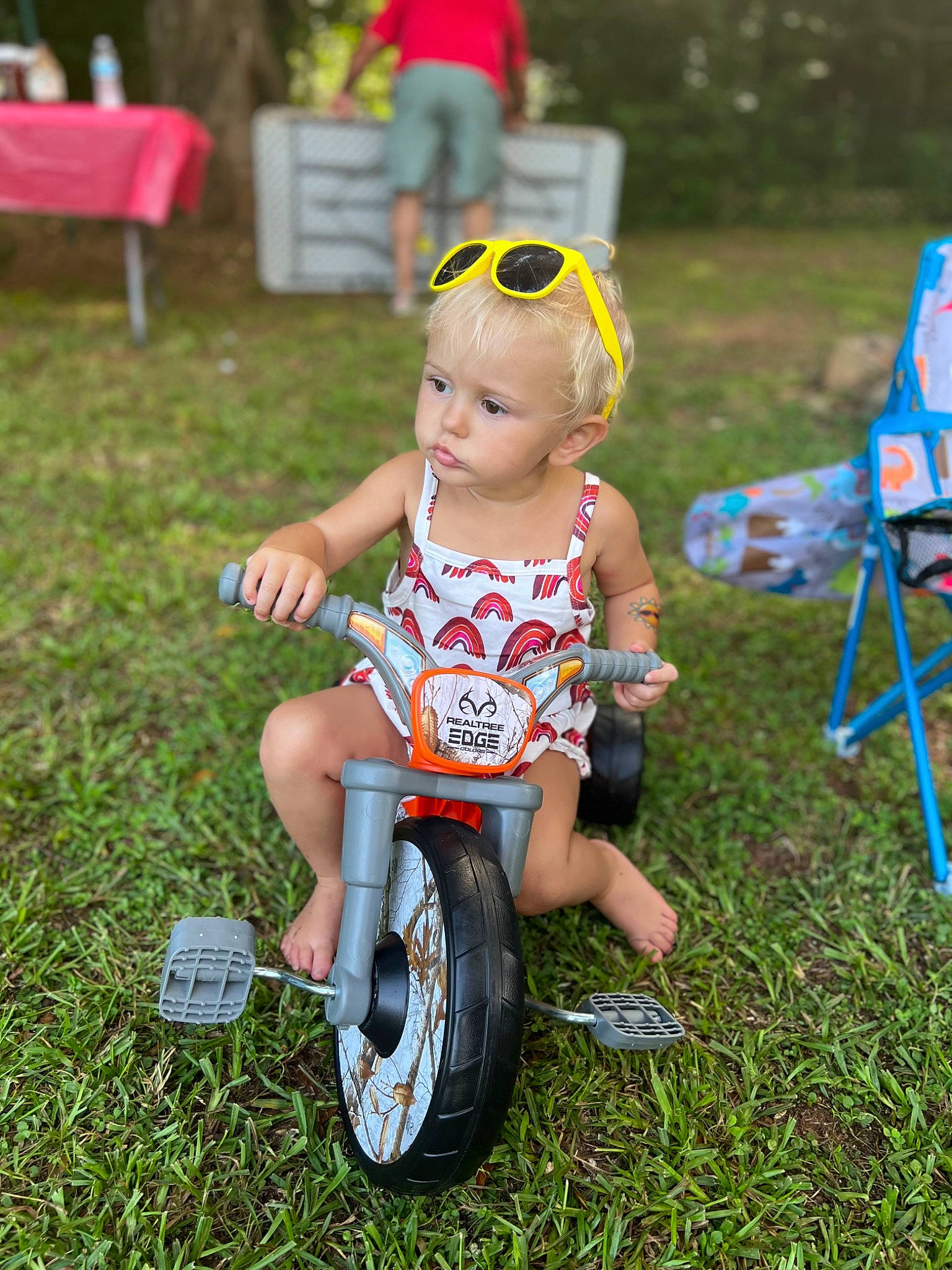 Kimber joined the competition — help win amazing prizes! automotive_tire, automotive_wheel_system, baby_toddler_clothing, bicycle, bicycle_handlebar, bicycle_tire, fun, grass, happy, leisure, person, personal_protective_equipment, recreation, riding_toy, shorts, sneakers, sunglasses, tire, toddler, toy