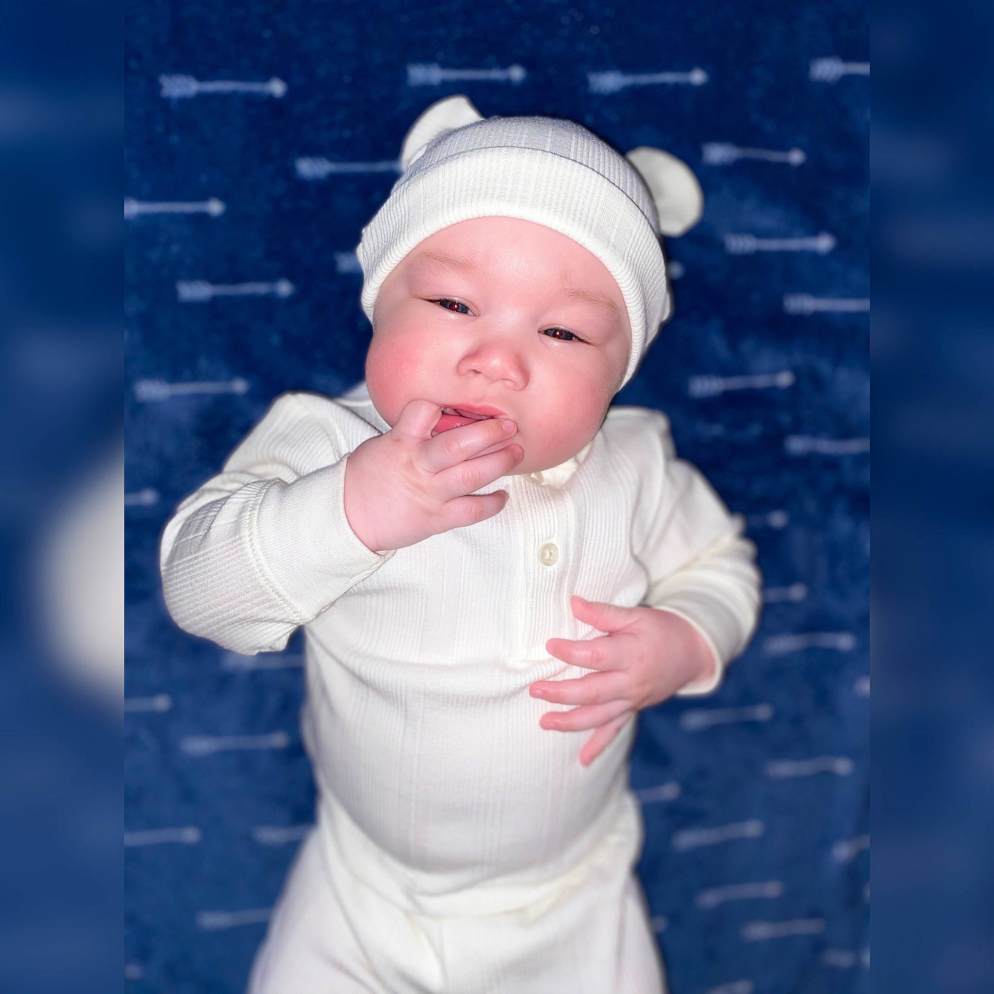 Loki is registered to the contest to win money with this photo: baby, baby_toddler_clothing, beanie, beauty, cap, child, day_dress, electric_blue, face, fashion_accessory, flash_photography, gesture, happy, headgear, headwear, lip, pattern, person, pink, portrait_photography