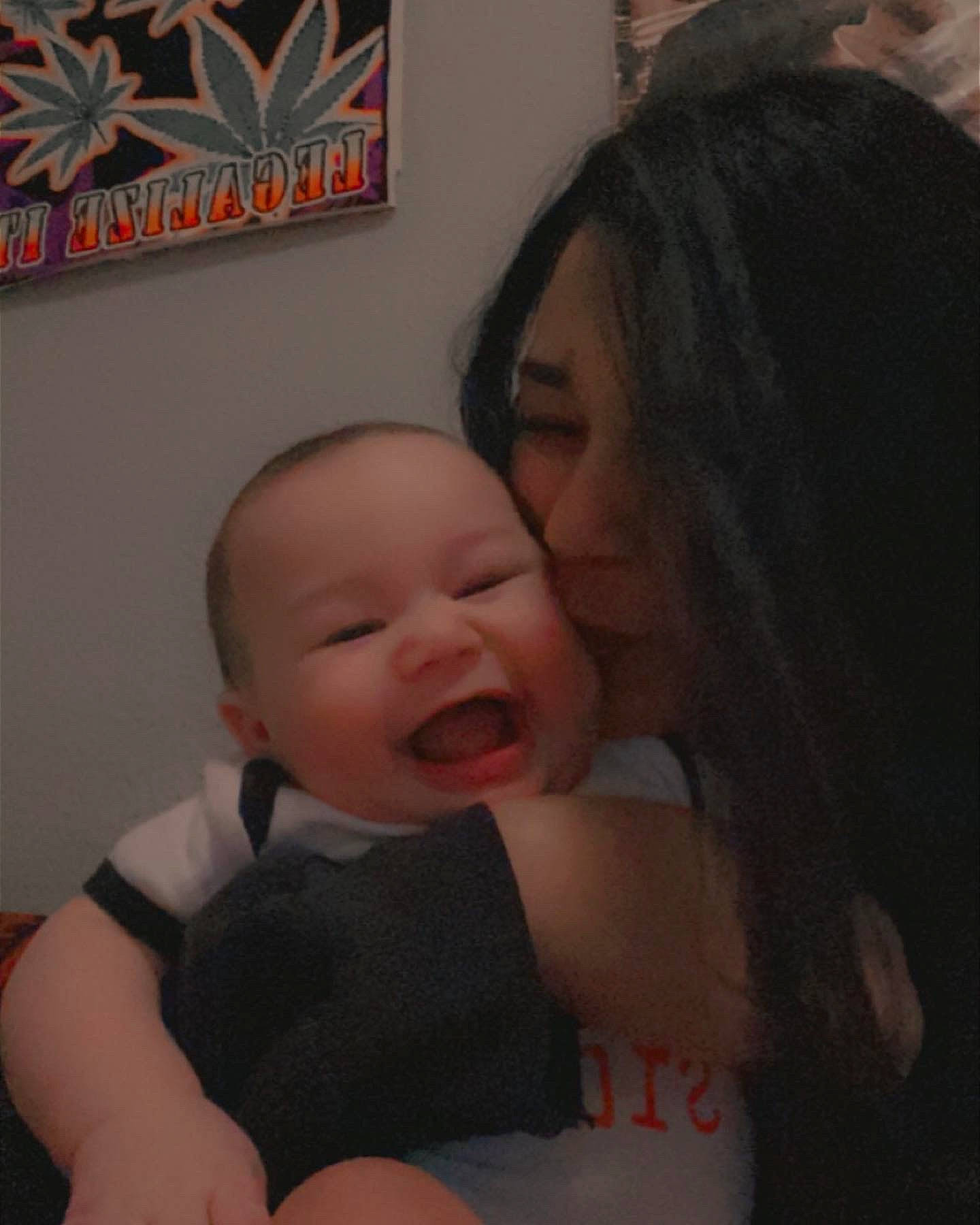 Loki is registered to the contest to win money with this photo: baby, baby_toddler_clothing, black, cheek, comfort, ear, eyebrow, fun, gesture, hairstyle, happy, iris, lip, mouth, nose, person, picture_frame, skin, smile, thumb