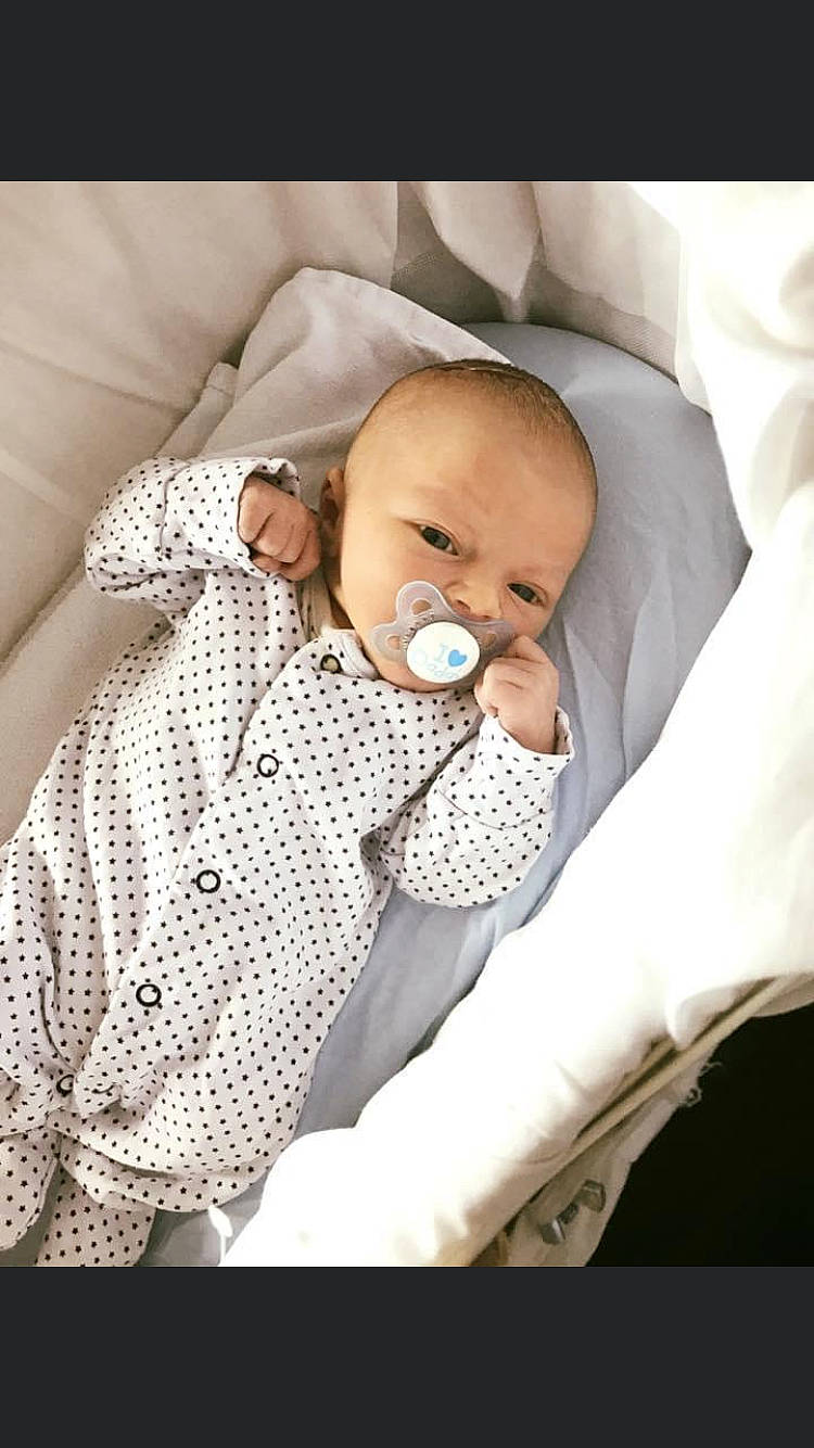 Archie Reynolds joined the competition — help win amazing prizes! baby, baby_products, baby_safety, baby_sleeping, baby_toddler_clothing, bedtime, child, comfort, event, finger, health_care, linens, nap, pattern, person, product, room, service, skin, textile