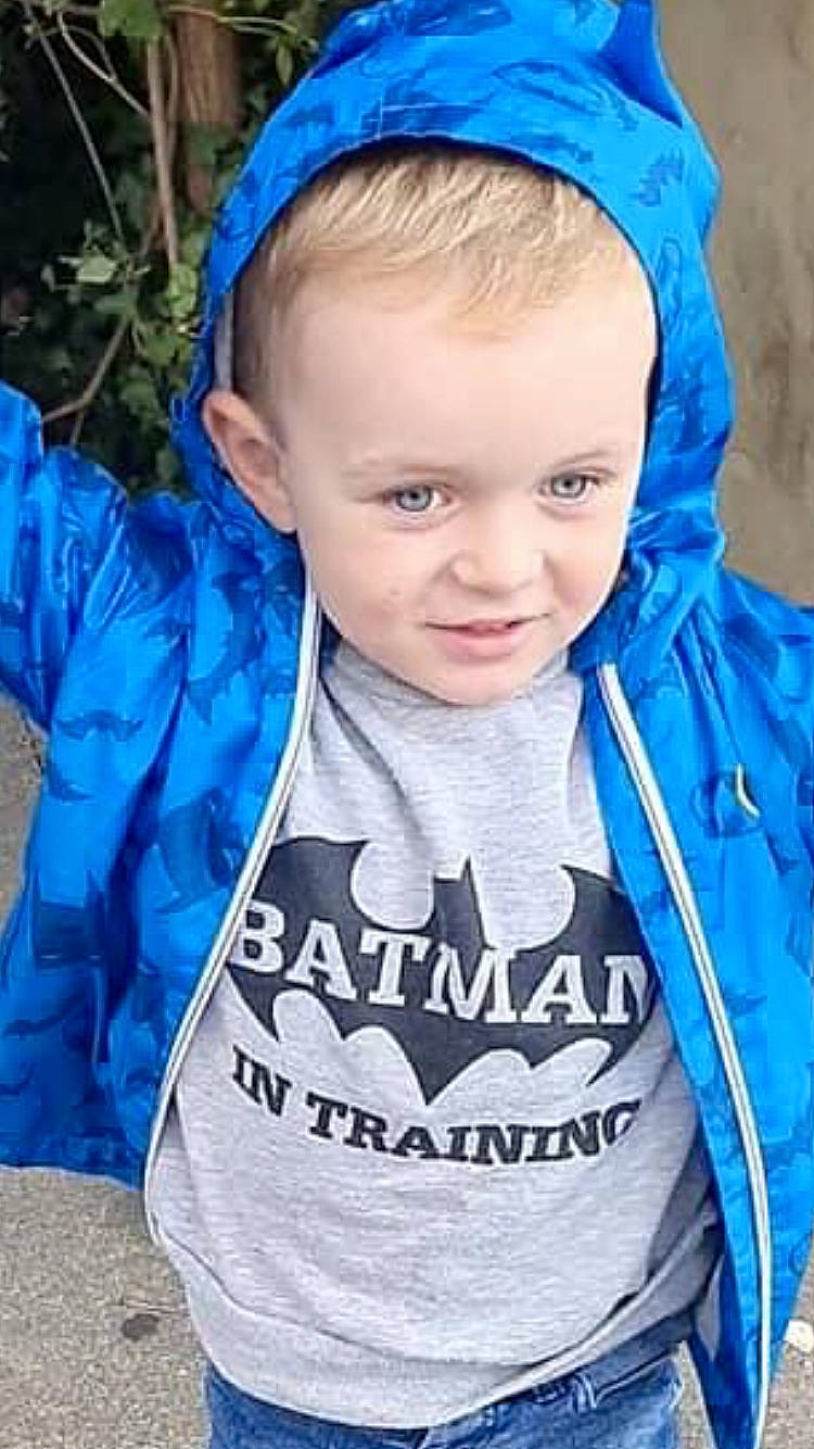 Archie Reynolds is registered to the contest to win money with this photo: blue, child, clothing, cool, electric_blue, eye, face, fashion, fun, happy, head, headgear, human, mammal, outerwear, people, person, sleeve, smile, toddler