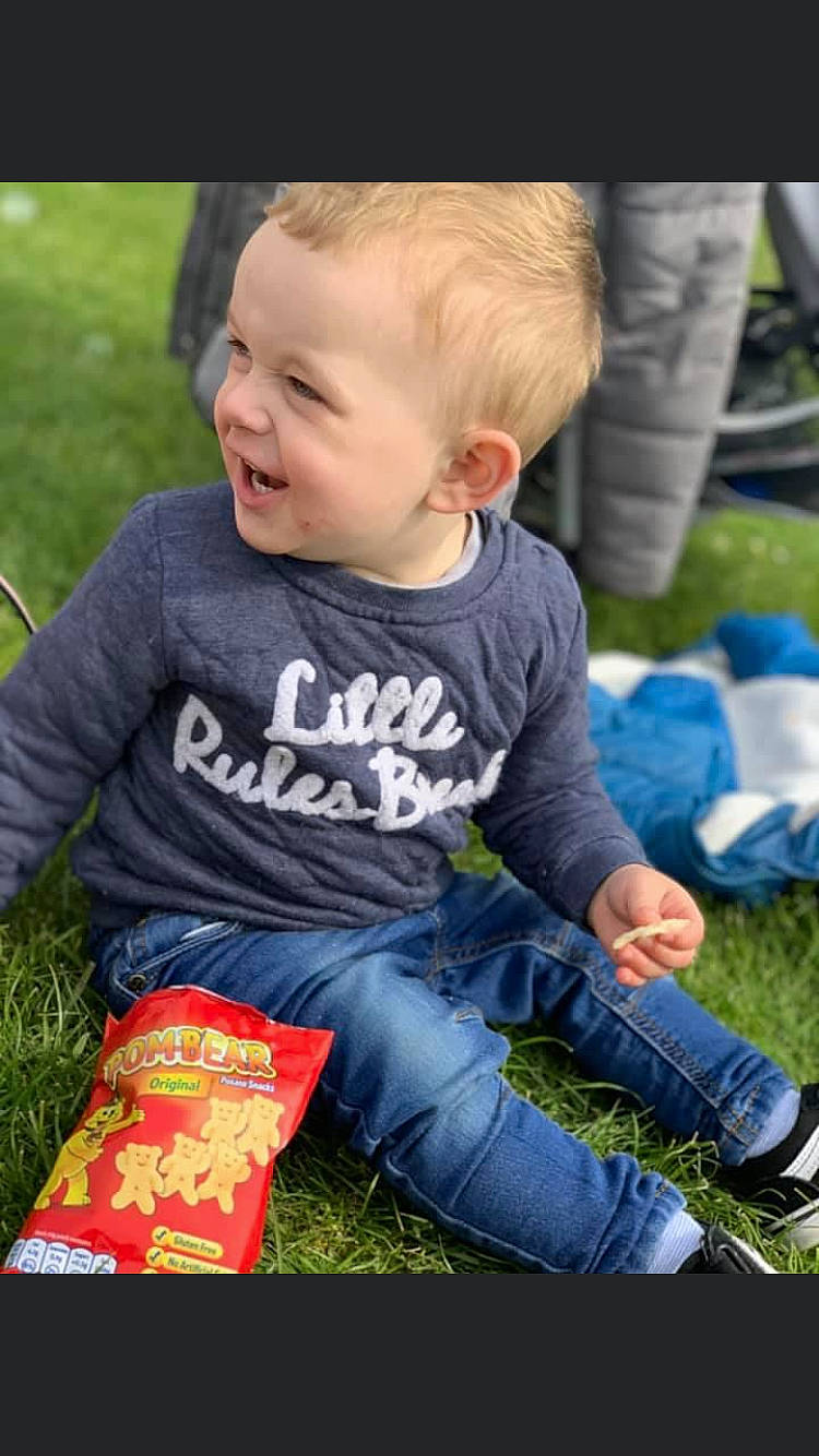 Archie Reynolds joined the competition — help win amazing prizes! baby, baby_toddler_clothing, child, face, fun, grass, happy, jeans, lawn, leaf, leisure, people_in_nature, person, plant, recreation, sitting, skin, smile, summer, t_shirt