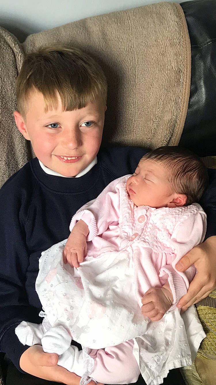 Darcey-mae Elizabeth is registered to the contest to win money with this photo: baby, baby_toddler_clothing, cheek, chin, comfort, eye, facial_expression, finger, gesture, hairstyle, happy, head, interaction, iris, joy, mammal, person, product, skin, sleeve