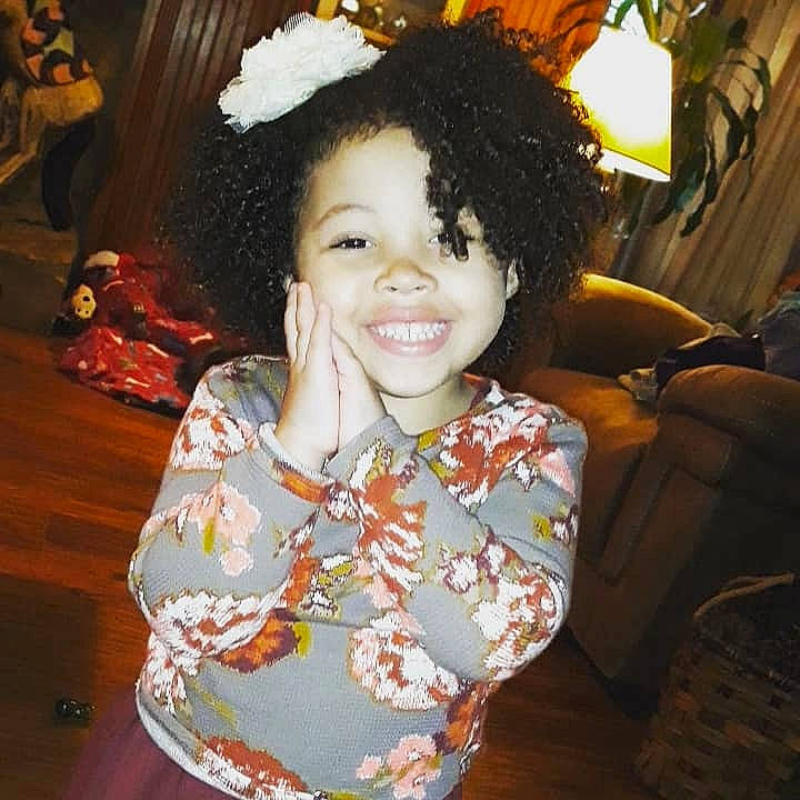 Max is registered to the contest to win money with this photo: brown_hair, child, day, girl, hairstyle, human_hair_color, joy, person, product, smile, textile, toddler